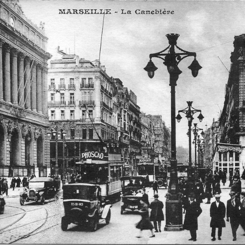 photo ancienne de la Canebière à hauteur de la Bourse du commerce vers 1930 au vu des voitures
